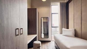 Departamento exclusivo | Caja de seguridad en la habitación y tabla de planchar con plancha