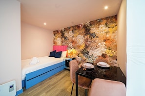 Departamento | 1 habitación, tabla de planchar con plancha, wifi gratis y ropa de cama 