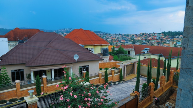 A residential area with houses featuring red-tiled roofs and brick walls. - Kigali Nice Apartment  (Kigali)