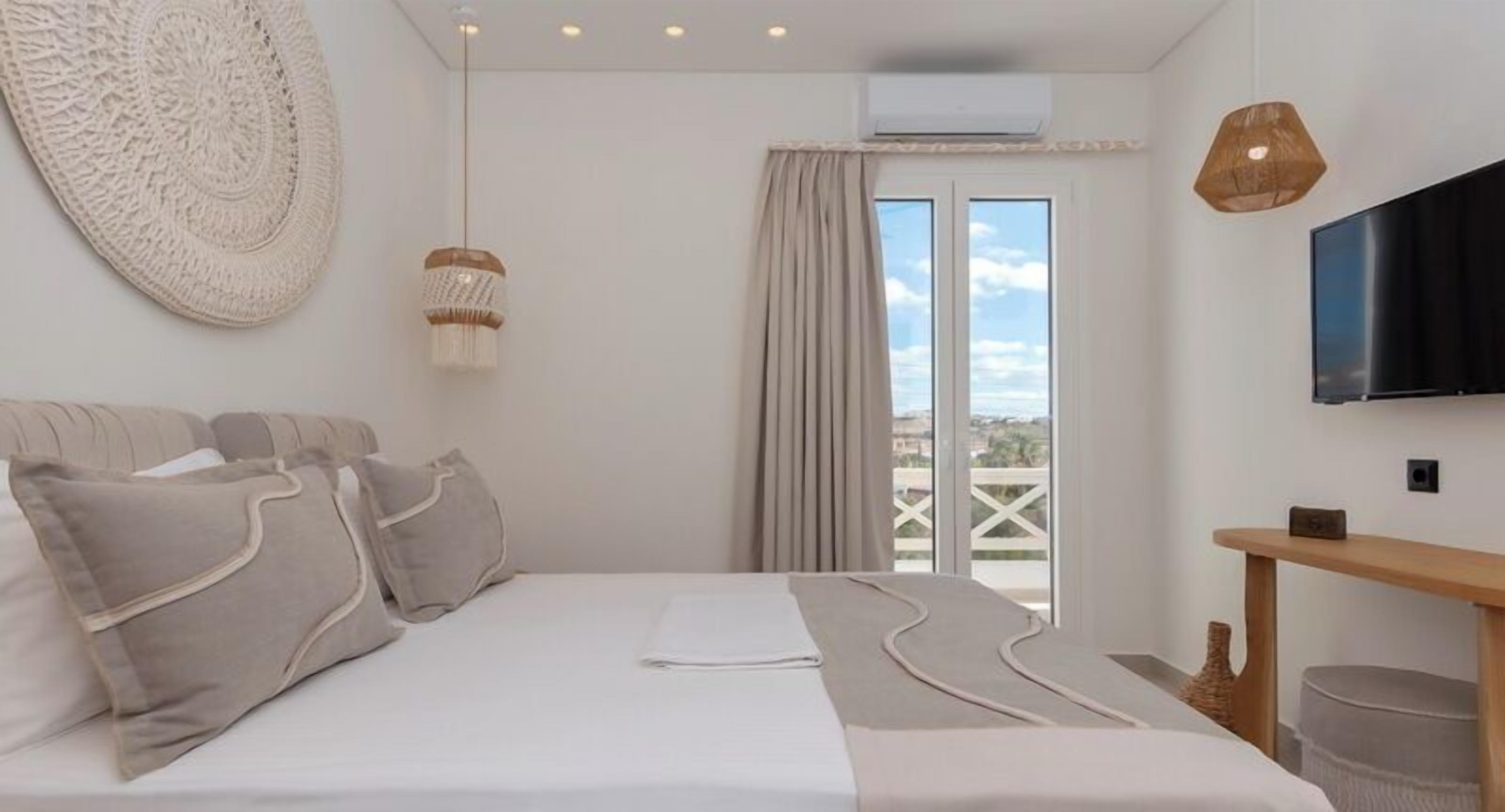 Deluxe Suite, City View | Premium bedding, individually decorated, individually furnished, desk