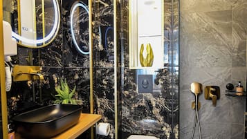 Deluxe Apartment, City View | Bathroom | Shower, hair dryer, towels, soap