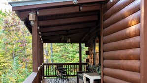 A wooden deck with a table and chairs, overlooking a forested area. - Visit Star Haven for Labor Day - Fiber Wifi! - Close to Callway Gardens (Warm Springs)