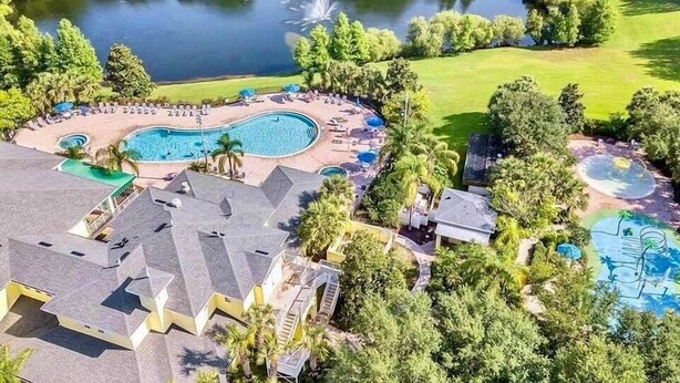 A resort with a large swimming pool, a lake, and a golf course. - Go!#12 - BAHAMA BAY - Three Bedroom Resort, Sleeps 6 (Davenport)