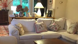 A living room with a sofa, armchairs, a coffee table, and a lamp. - Large, comfortable house in Bagneres  (Bagnères-de-Bigorre)