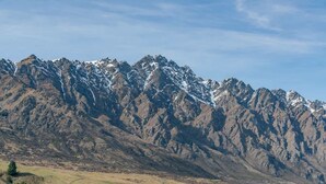 A mountainous landscape with snow-capped peaks and a valley below. - Studio Getaway, Remarkables Views, Frankton (Queenstown)