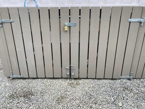 A closed metal gate with a padlock. - Spectacular VIEWS, 2 Bedrooms & BIG DECK! (Queenstown)