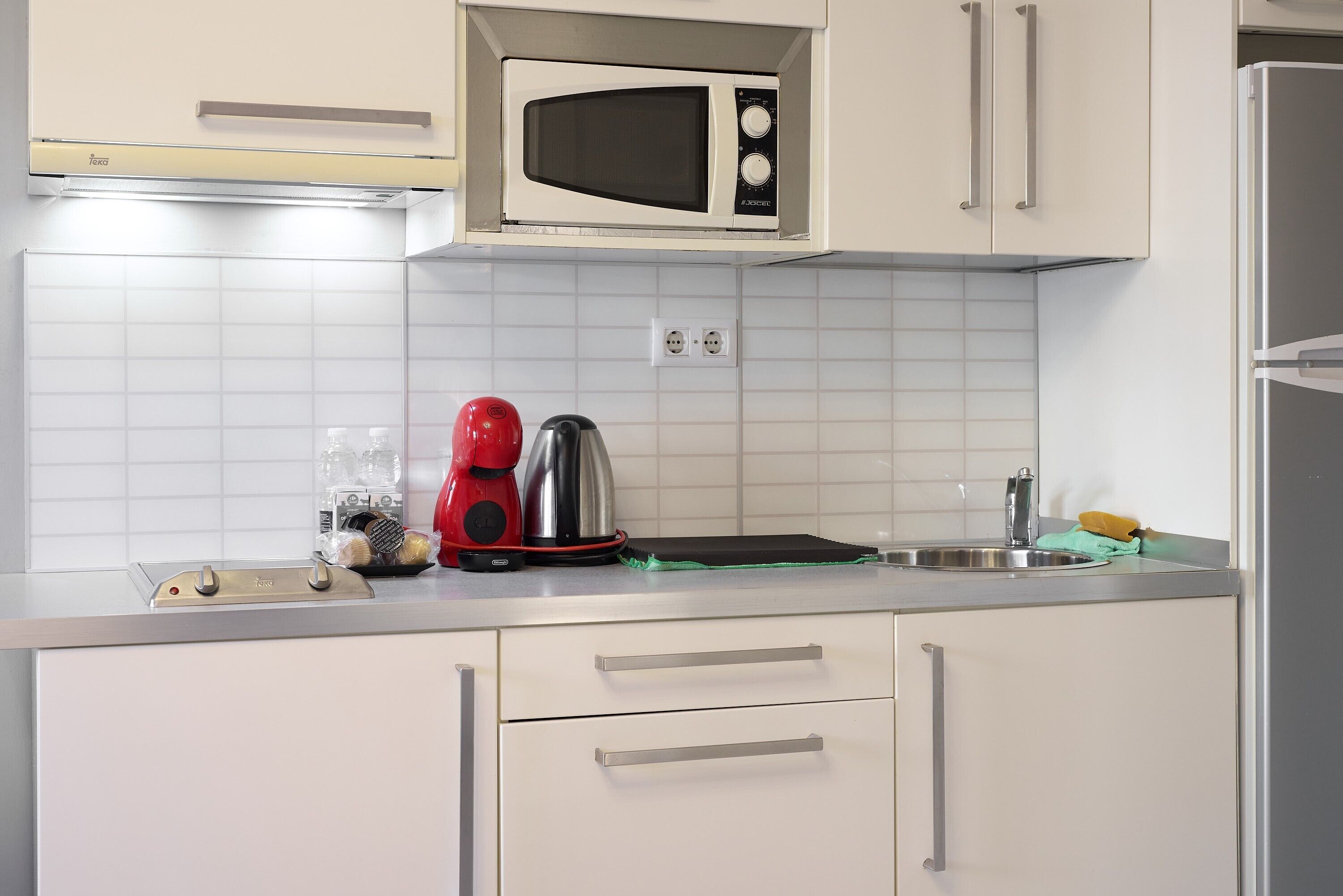 Fridge, microwave, stovetop, coffee/tea maker