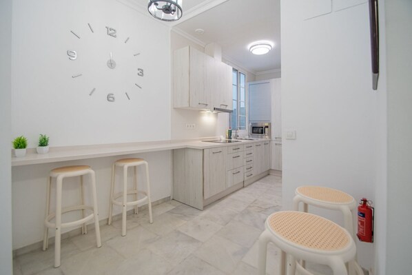 Microwave, stovetop, coffee/tea maker, toaster