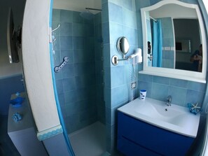 Shower, hair dryer, towels, soap
