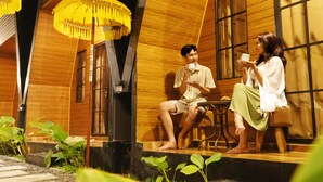 A wooden building with a stage and seating area. - Dsvarga Glamping (Depok)