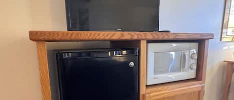 Premium bedding, desk, laptop workspace, iron/ironing board