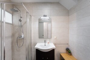 Shower, hair dryer, towels, soap