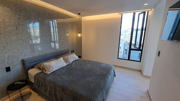 1 slaapkamer, een strijkplank/strijkijzer, wifi, beddengoed