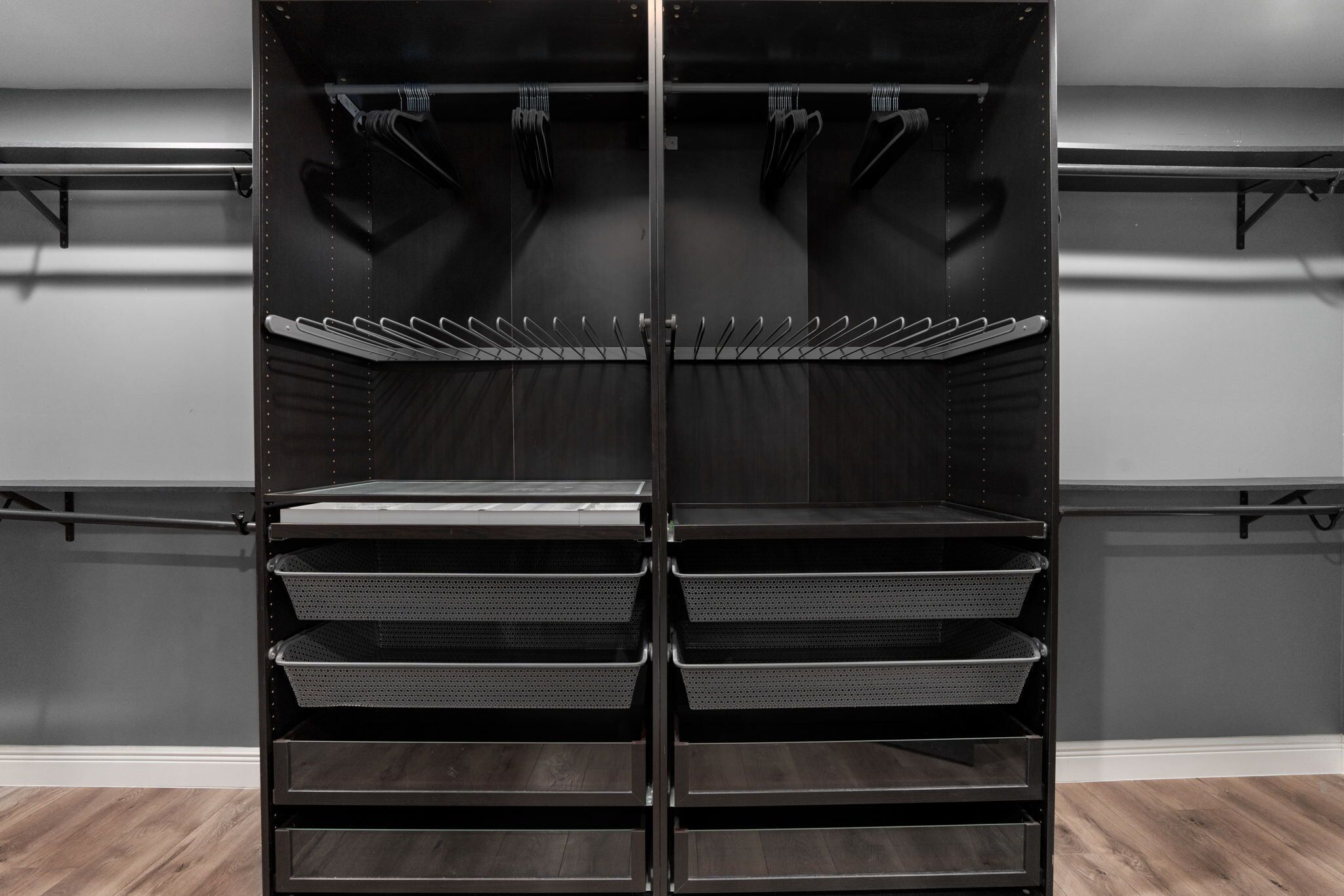 A storage unit with multiple shelves and hooks, likely for hanging items.