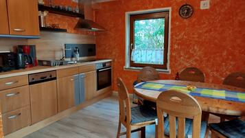 Fridge, stovetop, dishwasher, coffee/tea maker