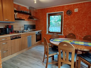 Fridge, stovetop, dishwasher, coffee/tea maker