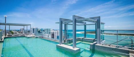 Outdoor pool, a heated pool, open 6:00 AM to 10:00 AM, pool umbrellas