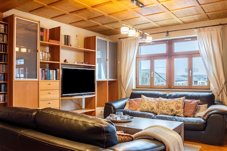 TV, fireplace. Apartment with Private Sauna, Balcony and Wi-Fi