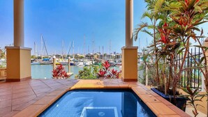 A swimming pool with a view of a marina. - Villa Utopia on the Marina | 3 Bed, 3 Bath by Tropical BNB (Stuart Park)