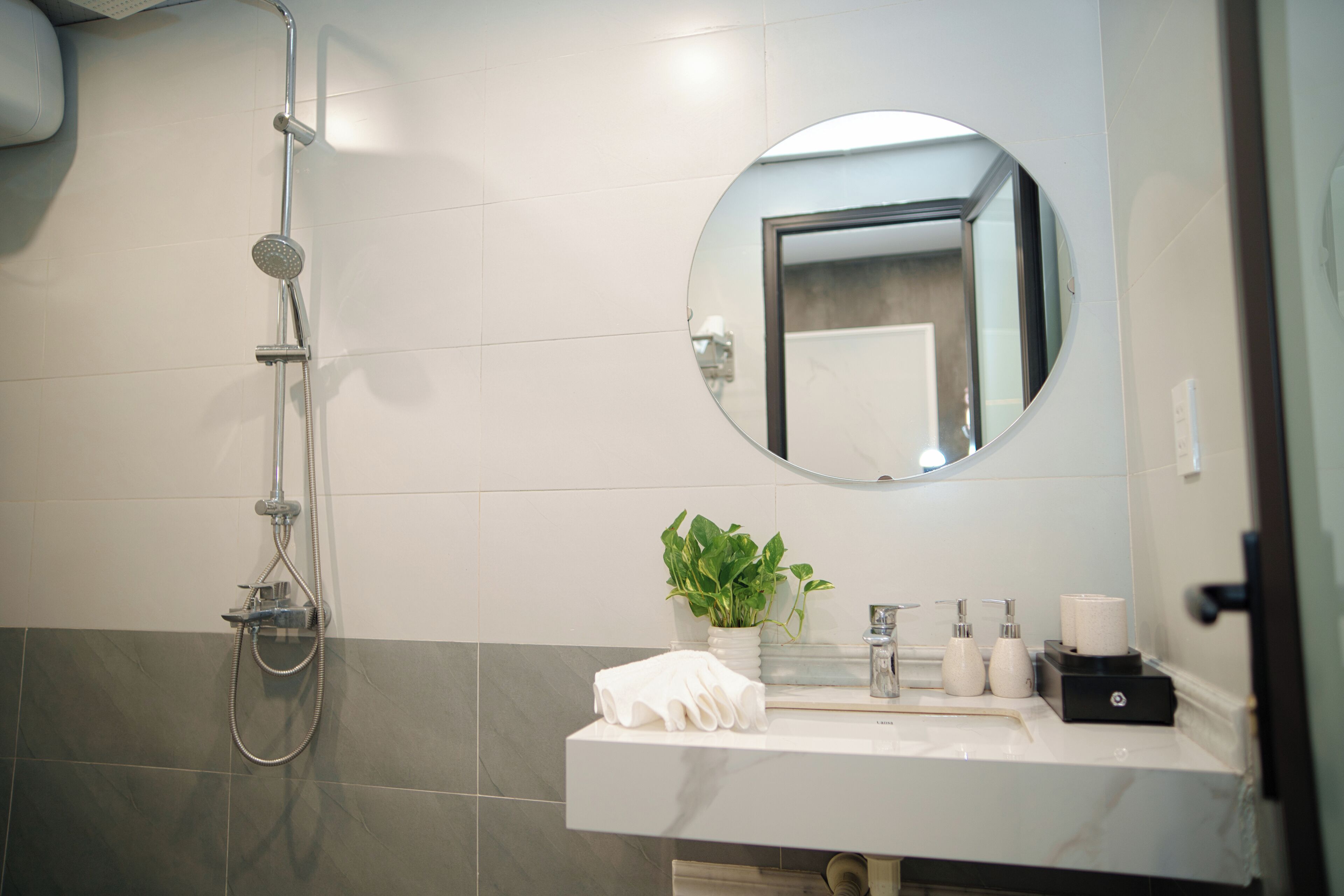 Shower, hair dryer, slippers, towels