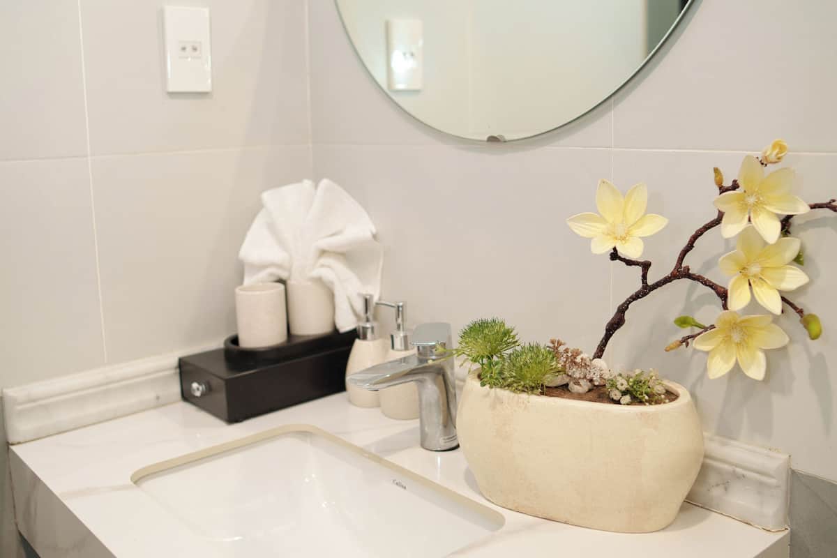 Shower, hair dryer, slippers, towels