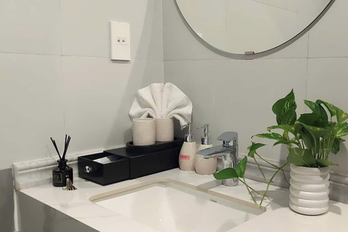 Shower, hair dryer, slippers, towels