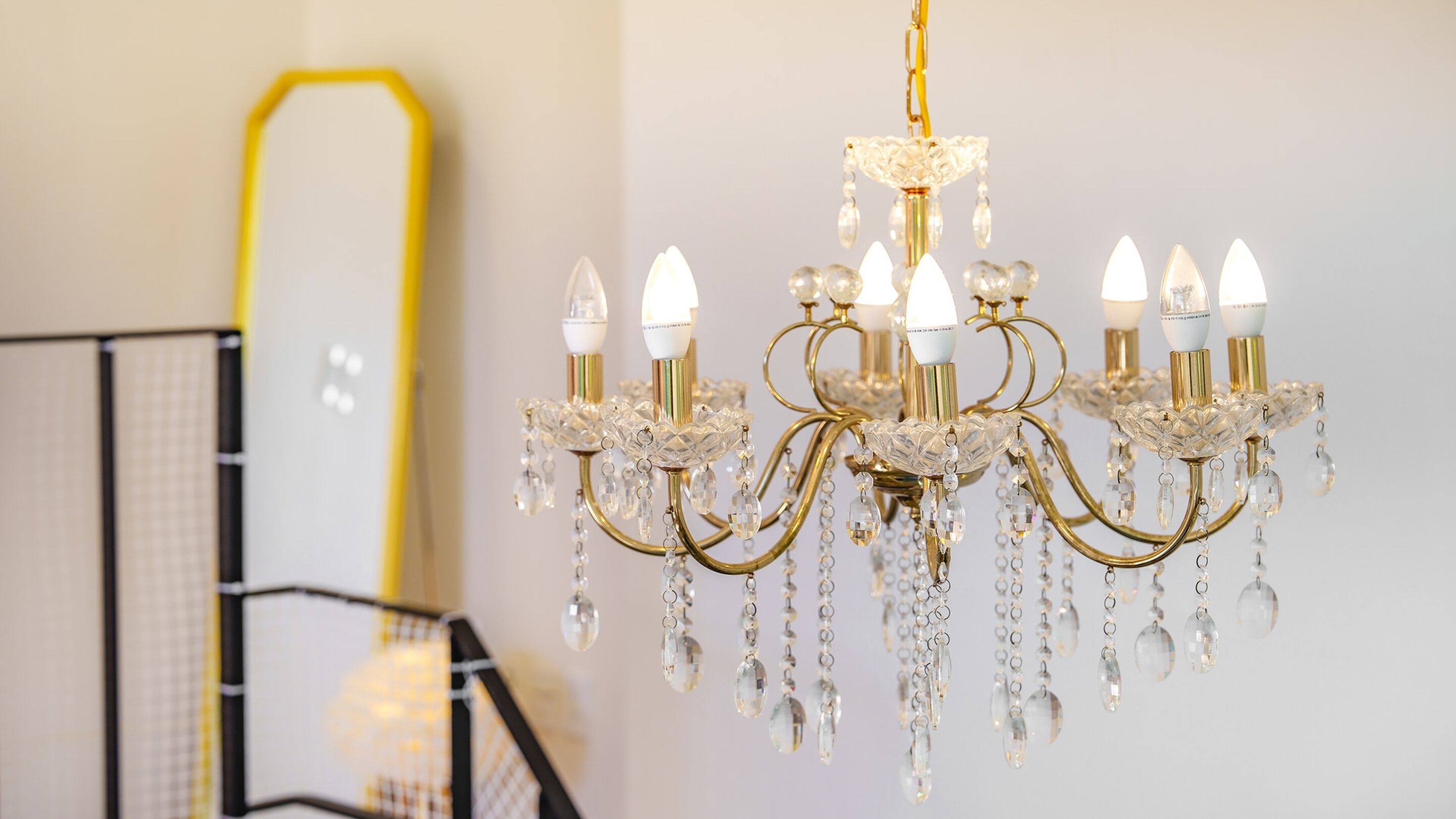 A chandelier with multiple lights and crystal decorations.