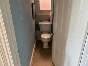 Shower, hair dryer, towels, toilet paper