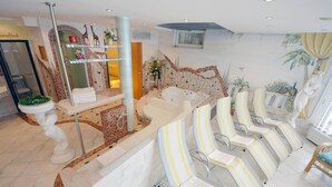A spa area with a reception desk, a large bathtub, and several striped chairs. - Apartment in Arzl-wald With Mountain Views (Arzl im Piztal)