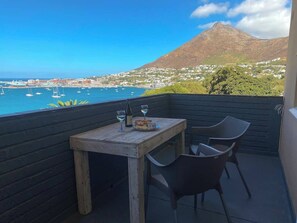 Outdoor dining - Simon’s Town Seaside Apt | Views, Balcony, Parking (Cape Town)