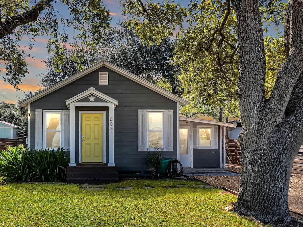 A single-story house with a front door, a small porch, and a visible number '603' on the door.