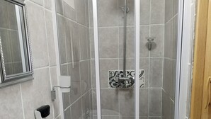 A bathroom with a shower, a sink, and a mirror. - Room-home of Peace and Tranquility (Pretoria)