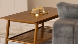 A modern, rectangular wooden table with a metal tray and two spherical objects on top. - Magical Themed 3BR Townhouse Near the Parks (Kissimmee)