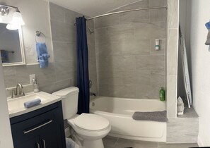 Shower, hair dryer, towels, soap