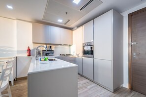 Fridge, microwave, oven, stovetop - Whimsical 1BR in East 40, Al Furjan by Deluxe Holiday Homes (Dubai)