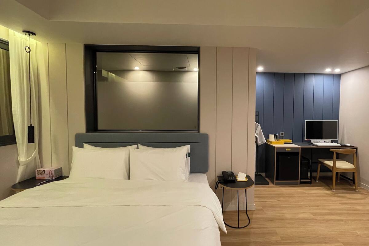 Desk, laptop workspace, blackout curtains, free WiFi