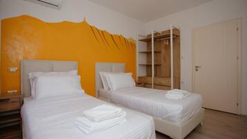 2 habitaciones, tabla de planchar con plancha, wifi y ropa de cama