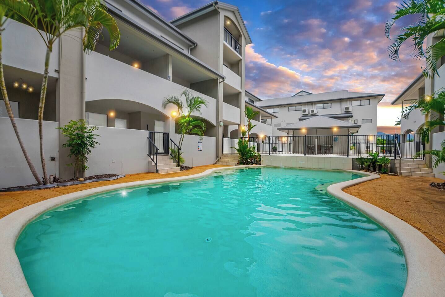 Take a dip in the complex swimming pool right downstairs, flanked by tropical palms.
