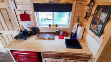 Microwave, stovetop, coffee/tea maker, cookware/dishes/utensils