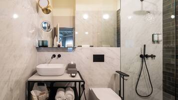 Shower, designer toiletries, hair dryer, bathrobes