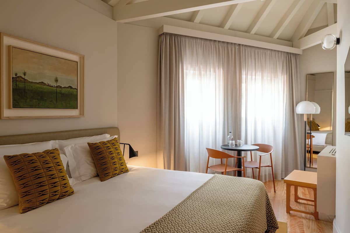 Double Room, City View | Minibar, in-room safe, laptop workspace, blackout drapes