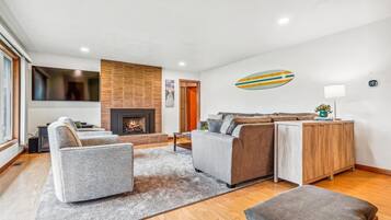 Smart TV, fireplace, foosball, books