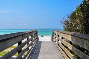 A wooden boardwalk leading to a beach with clear turquoise water and a clear sky. - Just Shellin' - Santa Rosa Beach, Walk to Shops + Dining, Walk to Beach! (Santa Rosa Beach)