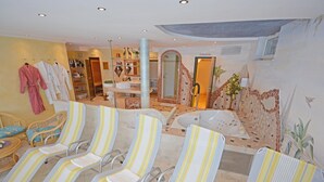 A spa area with multiple chairs, a bathtub, and a mirror. - Apartment in Pitztal Near Ski Slopes (Arzl im Piztal)