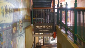 A staircase with a sign reading 'PROVISIONS Come to Gather.' - Lilac Home-Cozy home w/hot tub. Walking distance to Autzen, fine dining/shopping (Eugene)