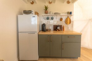 Fridge, coffee/tea maker, cookware/dishes/utensils