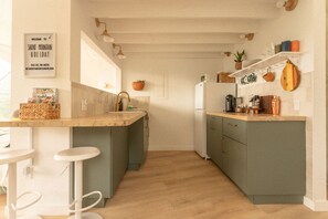 Fridge, coffee/tea maker, cookware/dishes/utensils