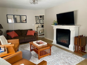 Family Suite | Living area | 55-inch Smart TV with digital channels, streaming services