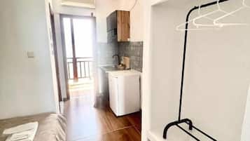 Classic Triple Room, Balcony, Beach View | Living area | 22-inch flat-screen TV with satellite channels, printers