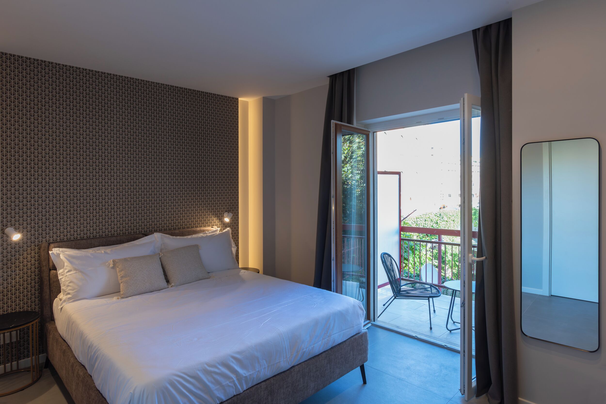 Deluxe Triple Room, Balcony | Free minibar, desk, laptop workspace, soundproofing